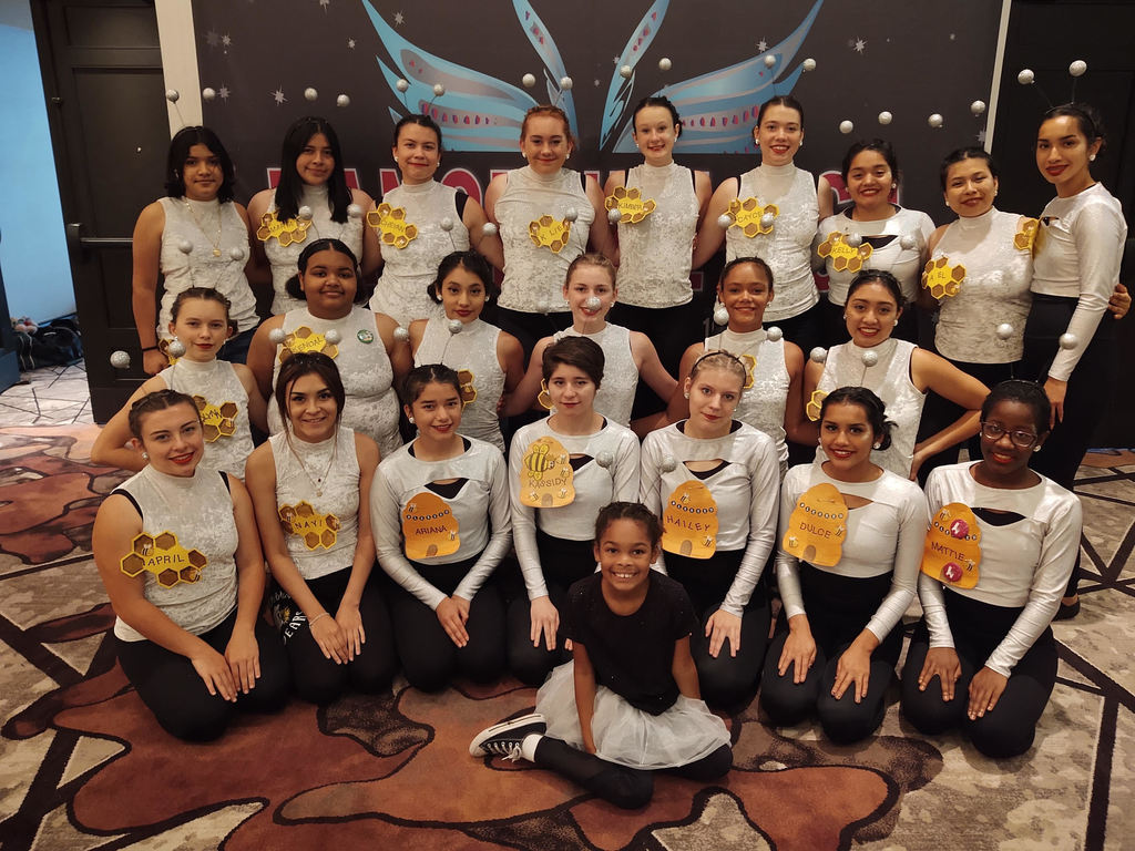 23 drill team members in uniform at camp