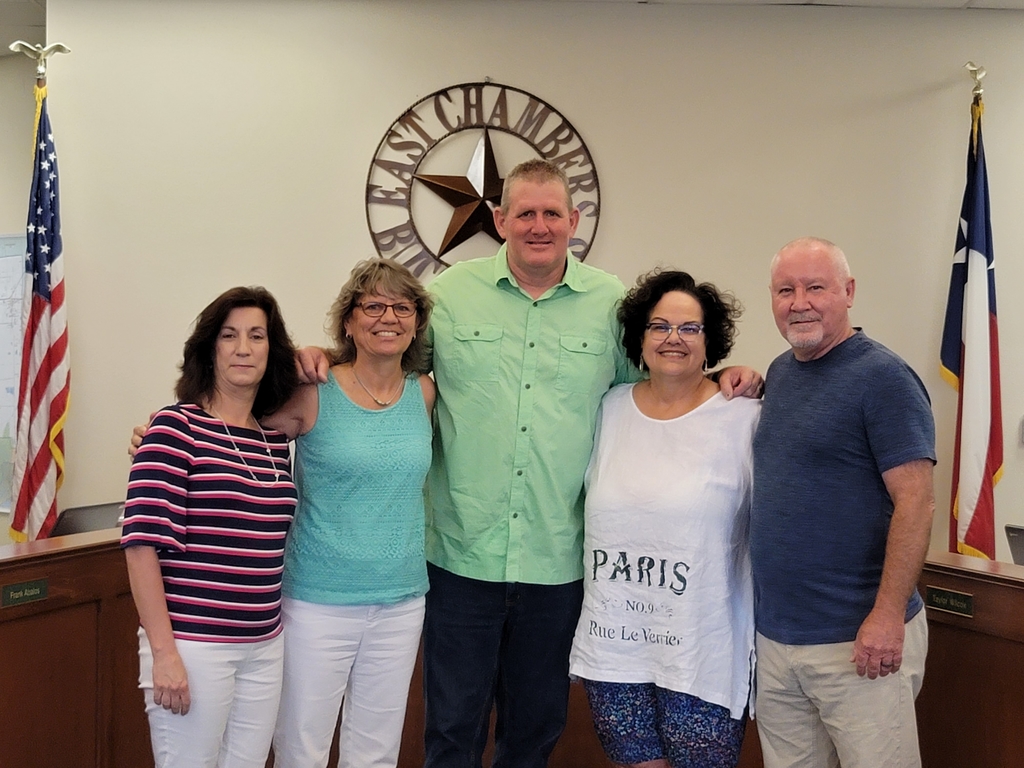 5 people standing in a group