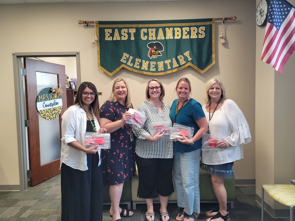 women holding school supplies 